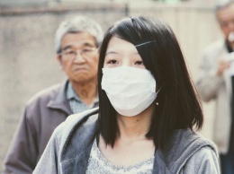 Китайские власти разрешили жителям столицы ходить без масок